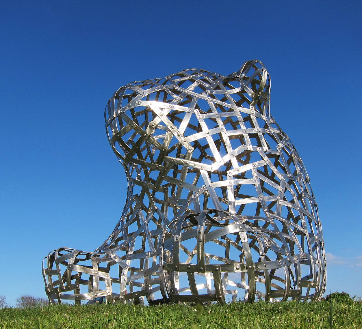 Sitting Bear sculpture in stainless steel by Peter Diepenbrock