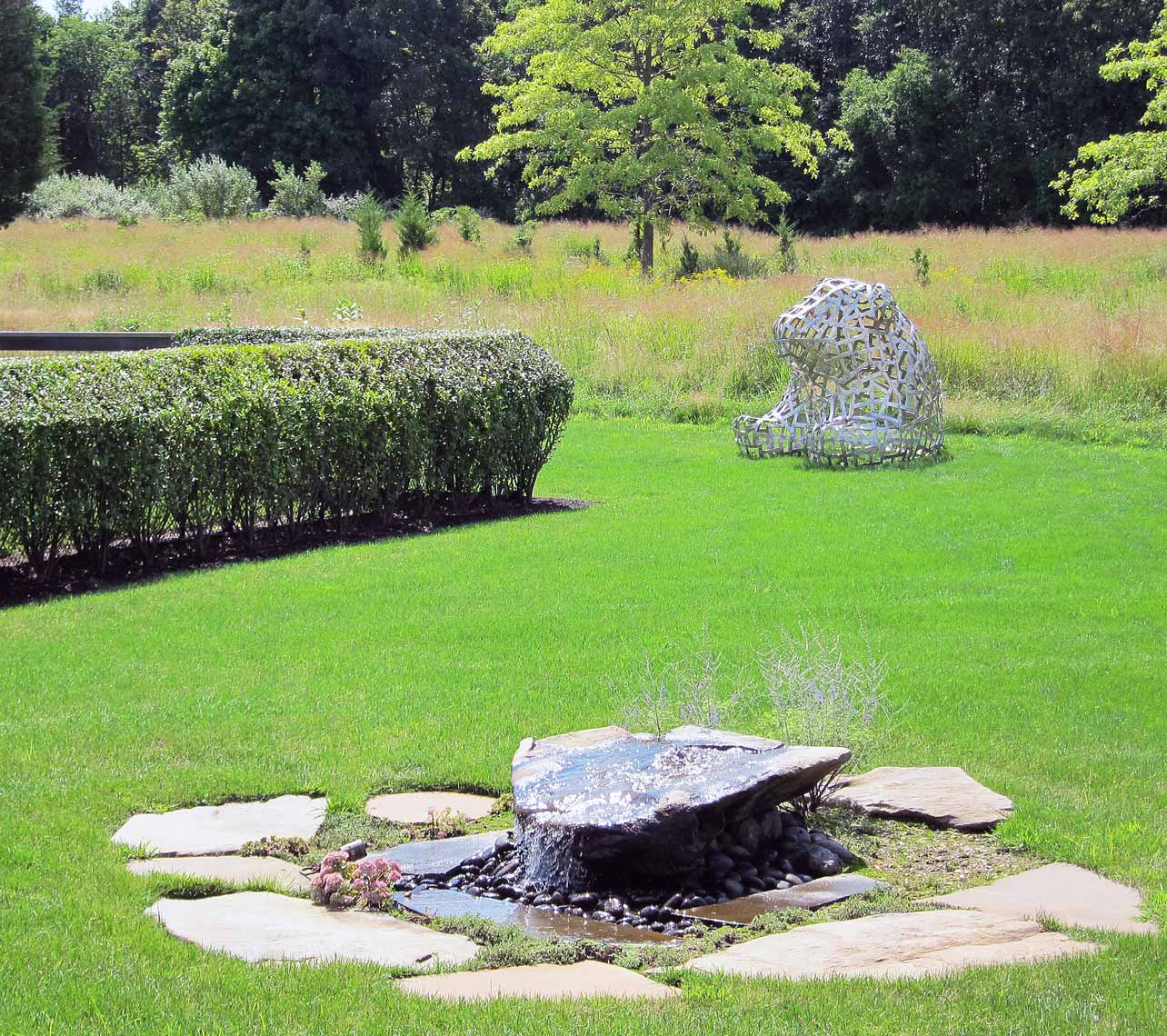 Sitting-Bear sculpture in Jamestown Residential garden by Peter Diepenbrock