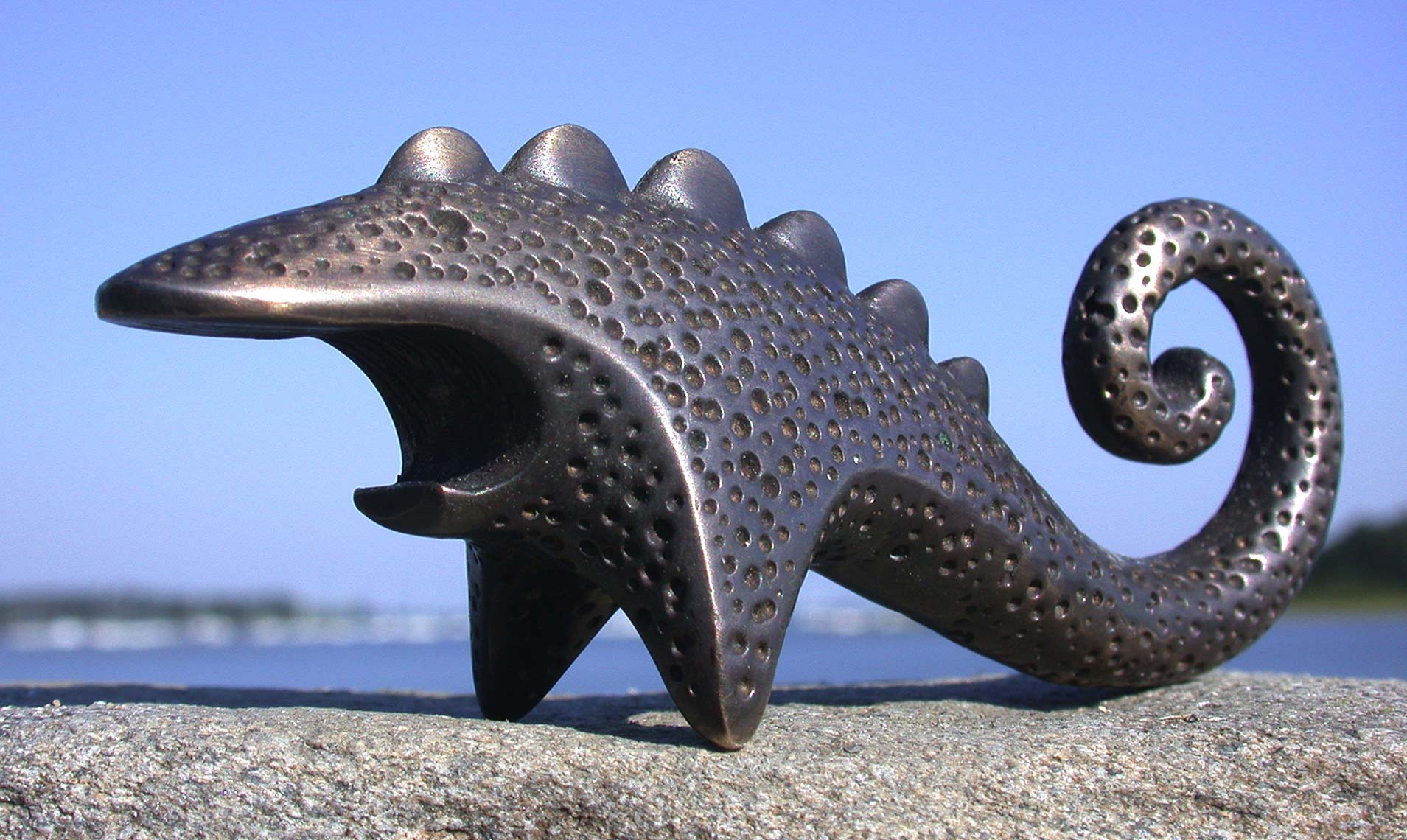 The Dinobite sculptural bronze bottle opener by Peter Diepenbrock